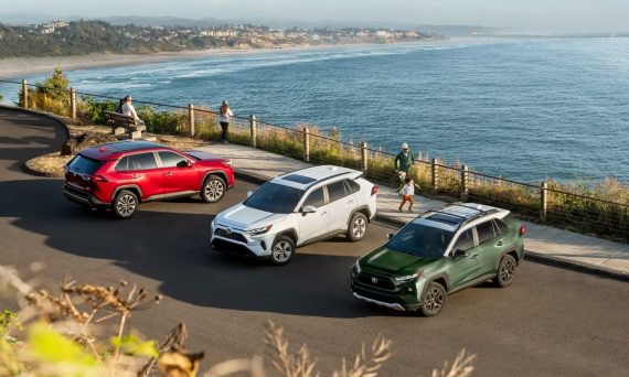 Three 2024 Toyota RAV4 Hybrids parked beside the beach